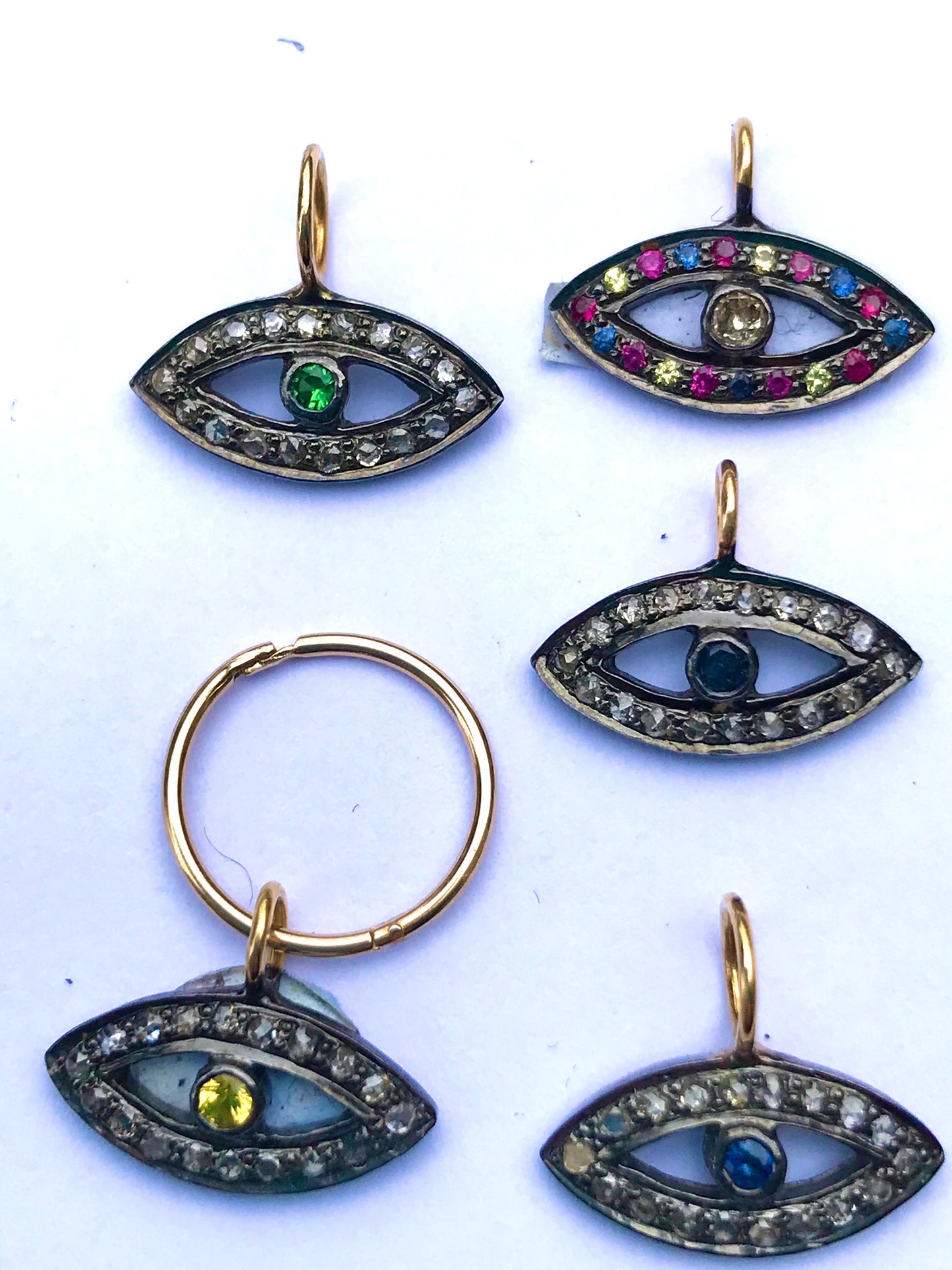 Diamond and Ruby protective eye pendent