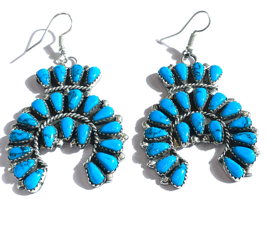 Unusual naja earrings with cross detail