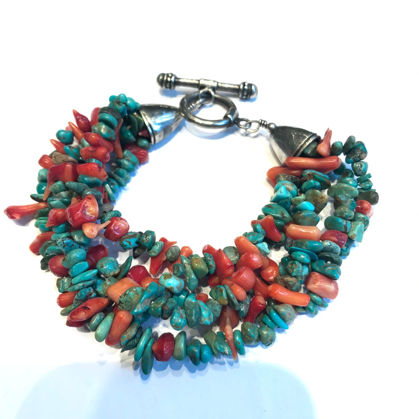 Multi row turquoise and spiny bracelet