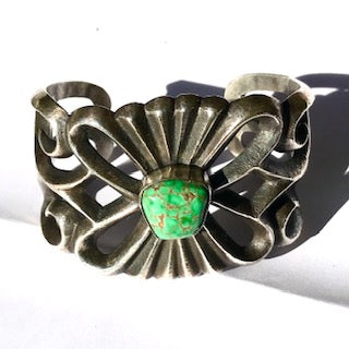 Sandcast  bracelet with rare green turquoise
