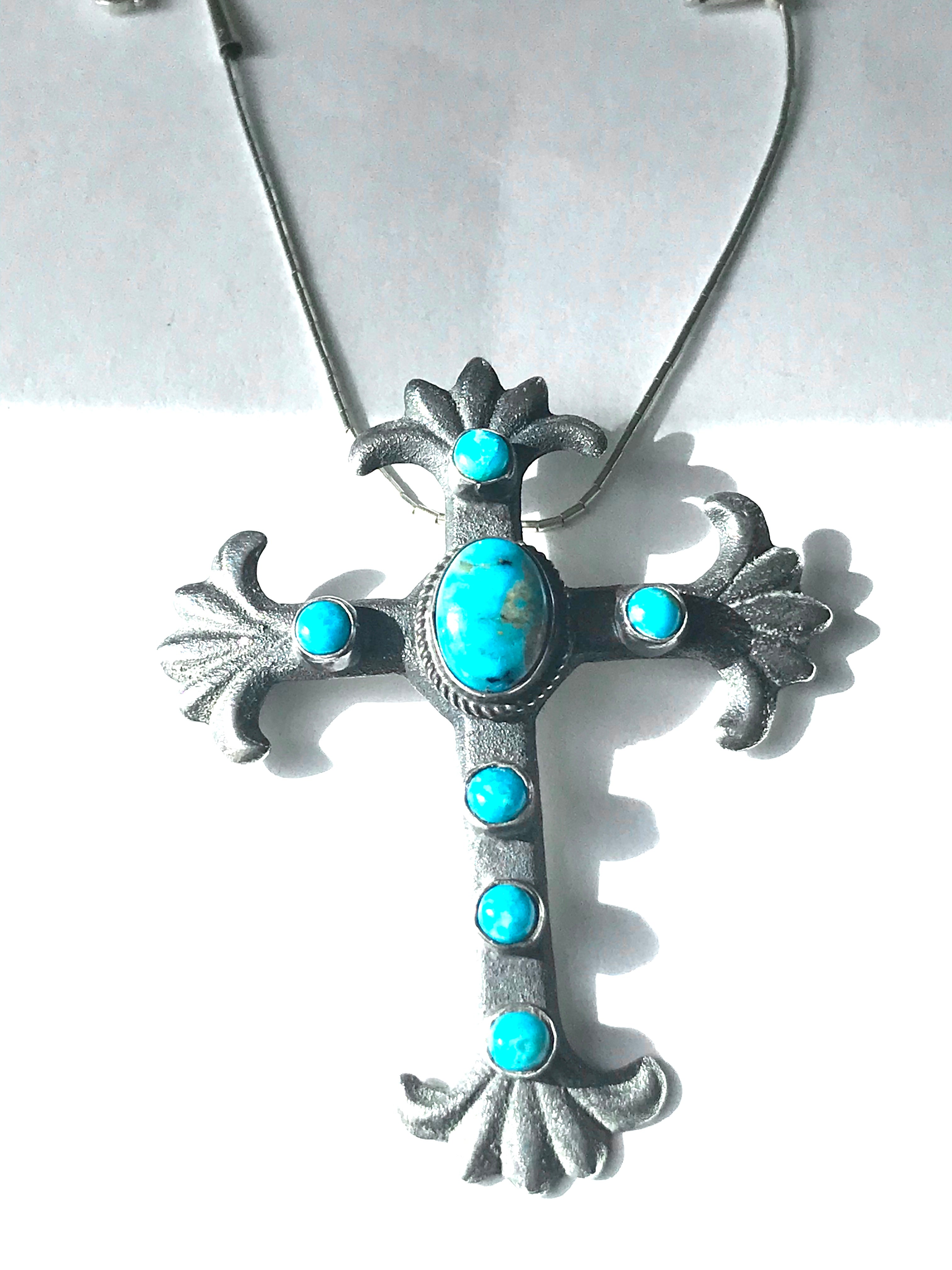 Turquoise cross pendent sand cast sterling silver