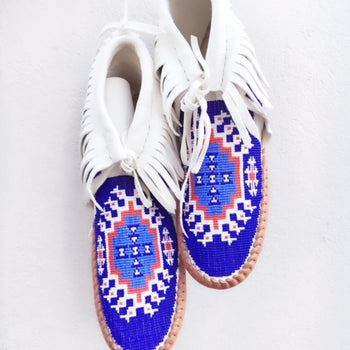 bright blue, white and red moccasins.