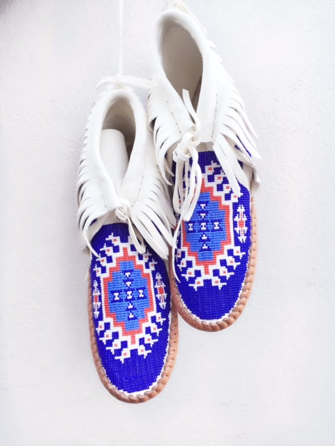 bright blue, white and red moccasins.
