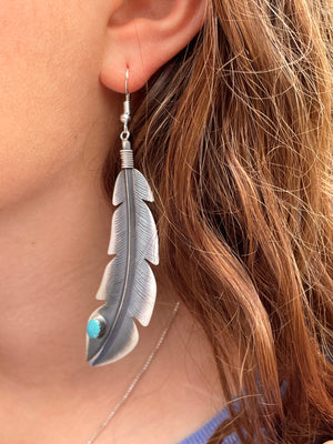 Large sterling silver feather earrings